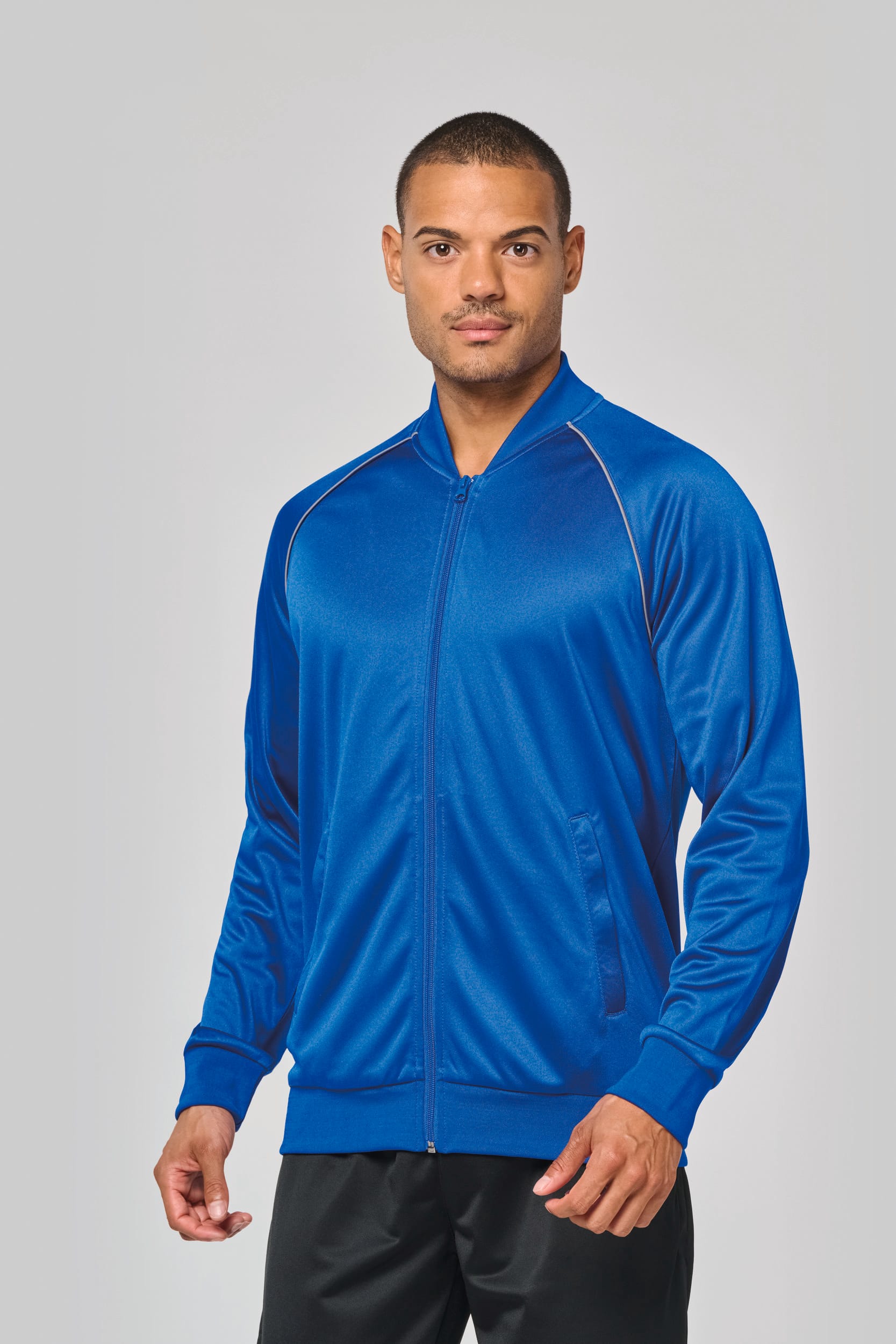 CHAQUETA DE DEPORTE CON CREMALLERA Y RIBETE - UNISEX